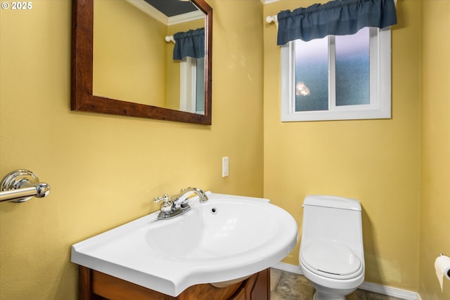 3985 Donald St, Eugene, OR 97405 - bathroom with toilet, vanity, and baseboards