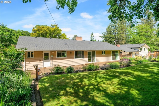 3985 Donald St, Eugene, OR 97405 - view of front of property with a front lawn, a chimney, a patio, and roof with shingles