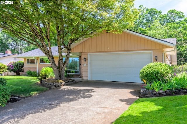 3985 Donald St, Eugene, OR 97405 - view of front of house featuring driveway, a front lawn, and an attached garage
