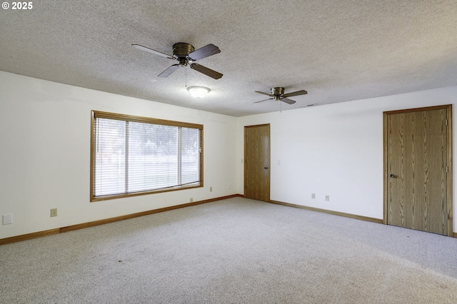 4805 NE 122nd Ave, Vancouver, WA 98682 - spare room featuring carpet floors, a ceiling fan, baseboards, and a textured ceiling