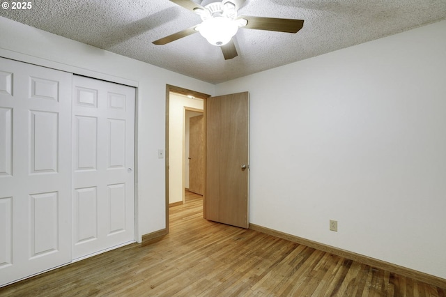 4805 NE 122nd Ave, Vancouver, WA 98682 - unfurnished bedroom featuring light wood finished floors, baseboards, a textured ceiling, a ceiling fan, and a closet