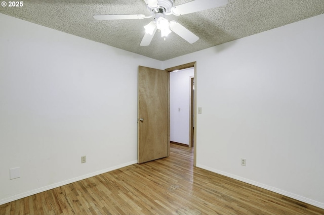 4805 NE 122nd Ave, Vancouver, WA 98682 - unfurnished room featuring wood finished floors, baseboards, ceiling fan, and a textured ceiling