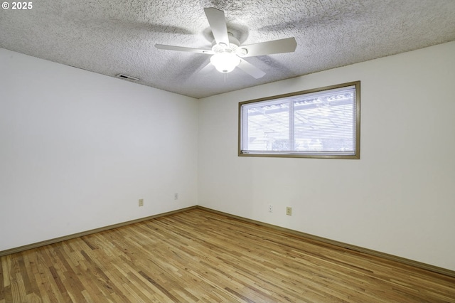 4805 NE 122nd Ave, Vancouver, WA 98682 - empty room featuring light wood finished floors, a ceiling fan, a textured ceiling, and baseboards