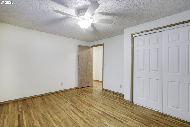 4805 NE 122nd Ave, Vancouver, WA 98682 - unfurnished bedroom with a textured ceiling, wood finished floors, baseboards, a closet, and a ceiling fan