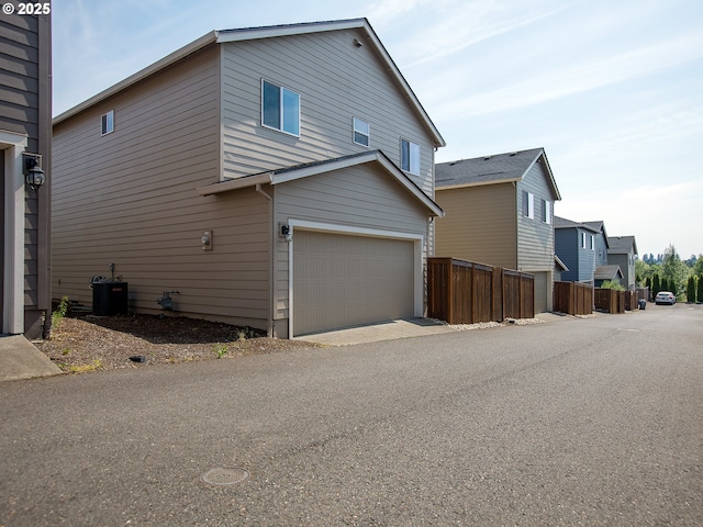7417 N 92nd Ave, Camas, WA 98607 - view of side of property with a garage and a central air condition unit