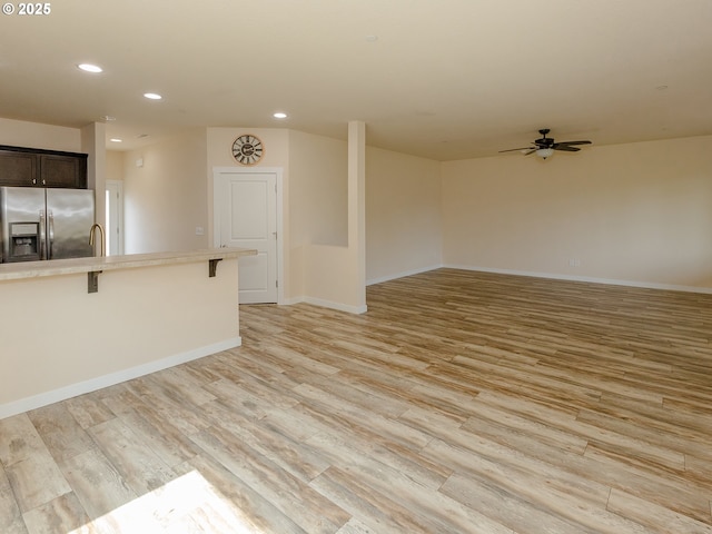 7417 N 92nd Ave, Camas, WA 98607 - unfurnished living room with a ceiling fan, recessed lighting, and light wood-style floors