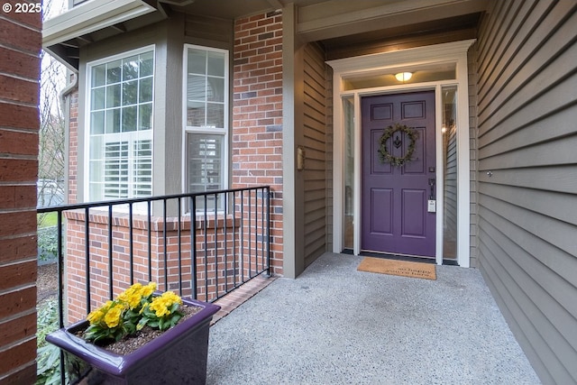 property entrance with brick siding