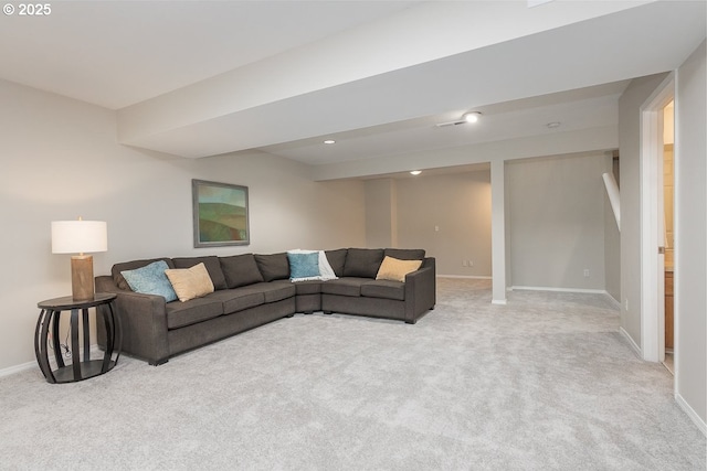 living room with recessed lighting, light colored carpet, and baseboards