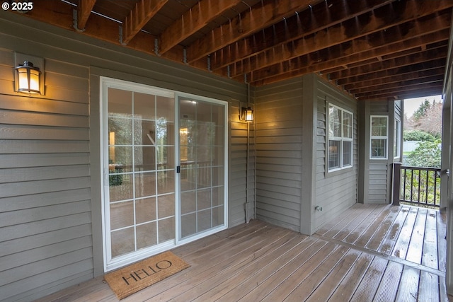 wooden terrace featuring covered porch