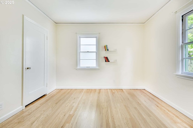 6814 N Wall Ave, Portland, OR 97203 - unfurnished room with wood finished floors, baseboards, and healthy amount of natural light