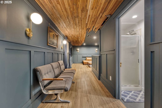 6814 N Wall Ave, Portland, OR 97203 - sitting room with wood ceiling, a decorative wall, light wood-style floors, and a wainscoted wall