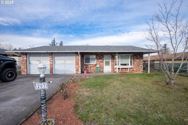 ranch-style home with a garage and a front yard