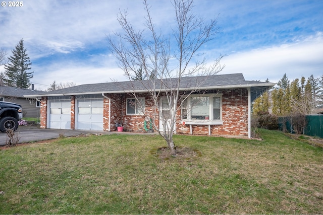 ranch-style home with a garage and a front lawn