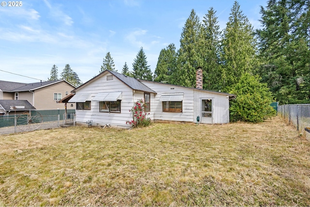 39005 Sandy Heights St, Sandy, OR 97055 - back of house with a chimney and a fenced backyard