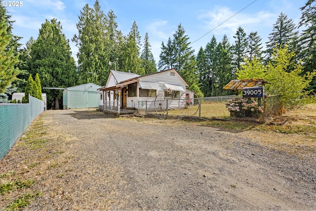 39005 Sandy Heights St, Sandy, OR 97055 - view of front of property with dirt driveway and an outbuilding