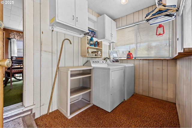 39005 Sandy Heights St, Sandy, OR 97055 - laundry room featuring washing machine and dryer, cabinet space, carpet floors, and wooden walls