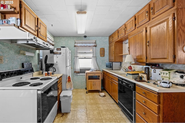 39005 Sandy Heights St, Sandy, OR 97055 - kitchen featuring white appliances, light countertops, brown cabinets, light flooring, and wallpapered walls