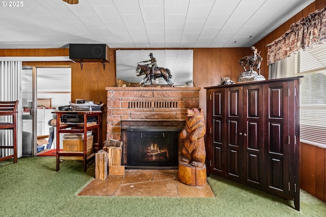 39005 Sandy Heights St, Sandy, OR 97055 - carpeted living area with a stone fireplace and wood walls