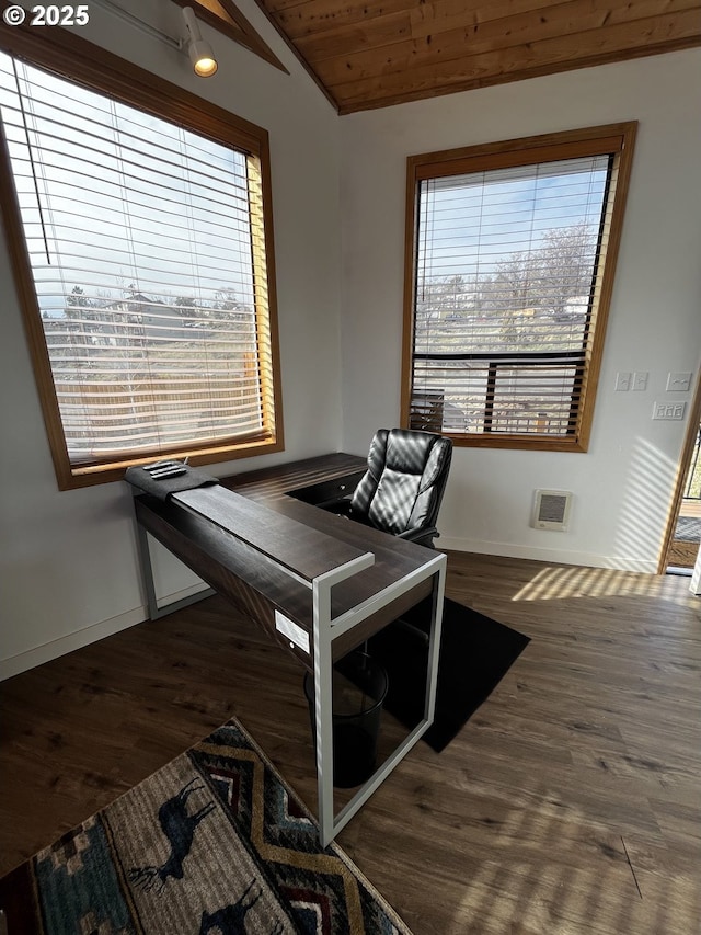 unfurnished dining area featuring vaulted ceiling, dark wood-type flooring, wood ceiling, and baseboards