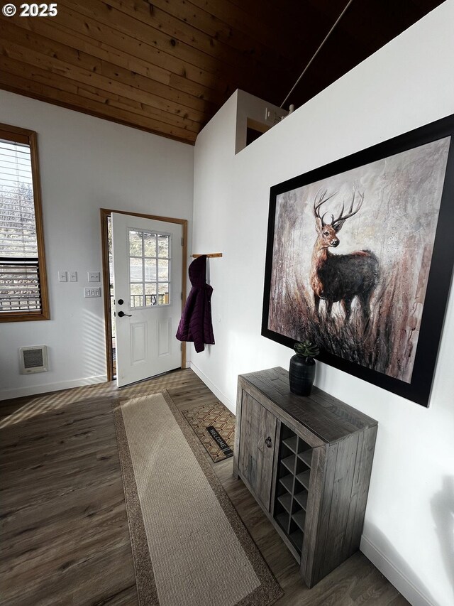 entrance foyer with lofted ceiling, wooden ceiling, a wealth of natural light, and wood finished floors