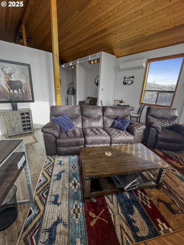 living room with vaulted ceiling, a wall unit AC, wood finished floors, and wood ceiling