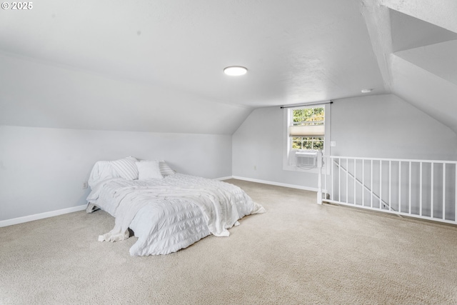bedroom with baseboards, carpet flooring, and vaulted ceiling