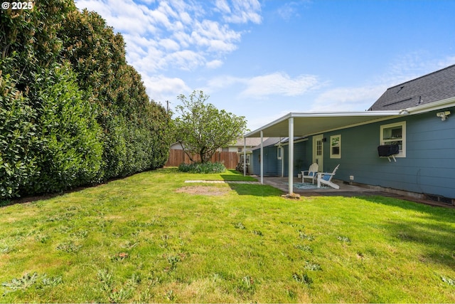 view of yard with fence and a patio area