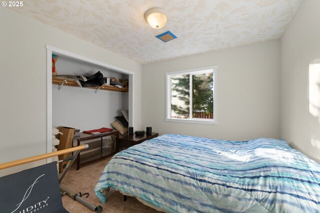 bedroom featuring a closet and carpet flooring