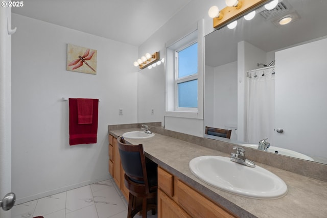 bathroom featuring vanity and walk in shower