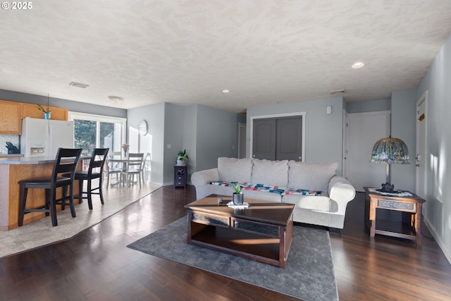 living room with dark hardwood / wood-style floors