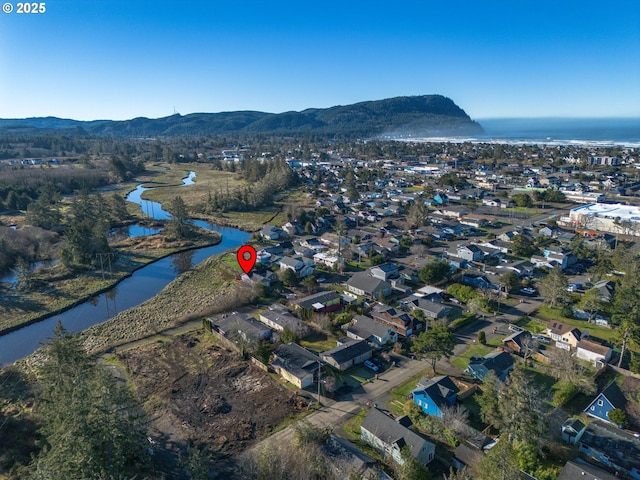 aerial view with a water and mountain view