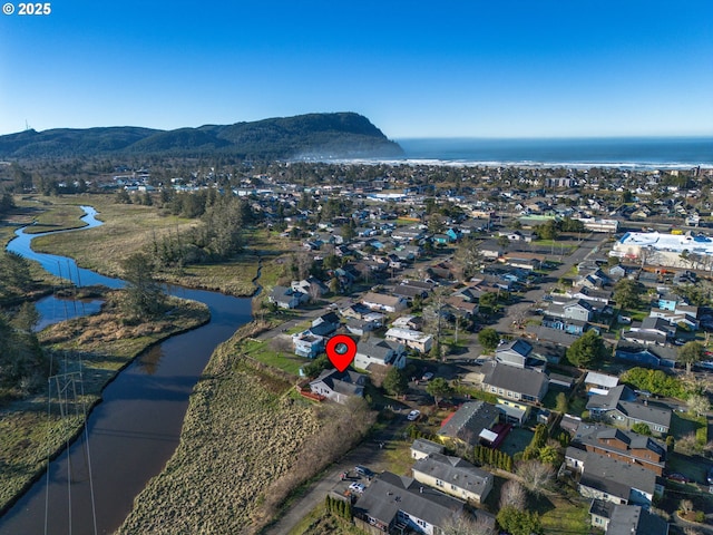 bird's eye view featuring a water and mountain view