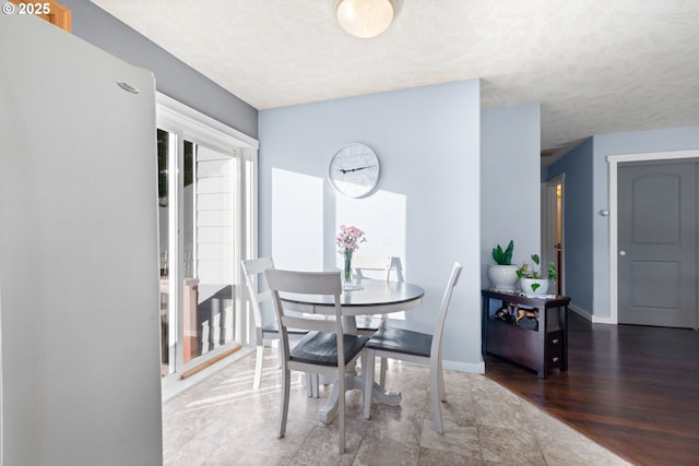 dining space with dark wood-type flooring