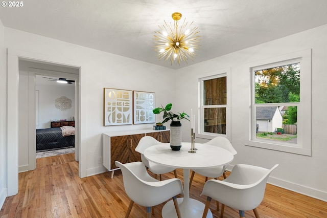 7170 SW 76th Ave, Portland, OR 97223 - dining area with a chandelier and light wood finished floors
