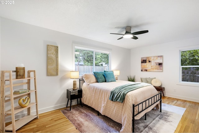 7170 SW 76th Ave, Portland, OR 97223 - bedroom with light wood-style floors and ceiling fan