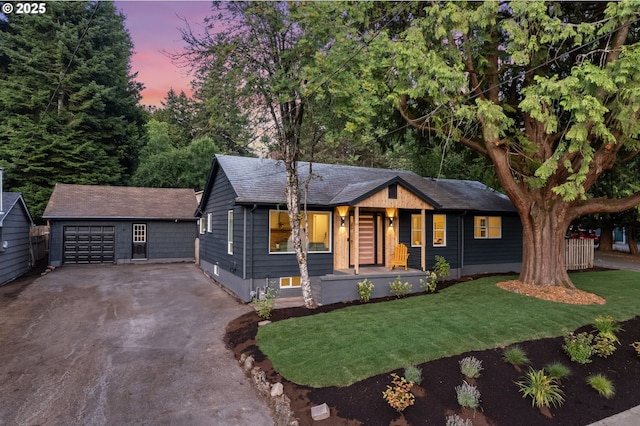7170 SW 76th Ave, Portland, OR 97223 - single story home with asphalt driveway, a front yard, an outdoor structure, an attached garage, and covered porch