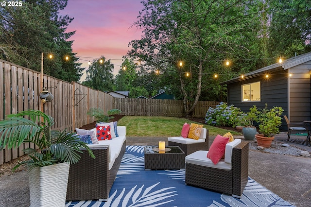 7170 SW 76th Ave, Portland, OR 97223 - patio terrace at dusk with an outdoor living space, a fenced backyard, and a patio
