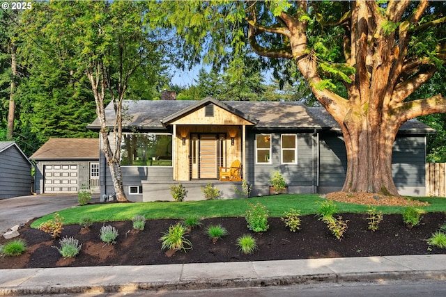 7170 SW 76th Ave, Portland, OR 97223 - view of front of house with a chimney, a front yard, an outbuilding, and a detached garage
