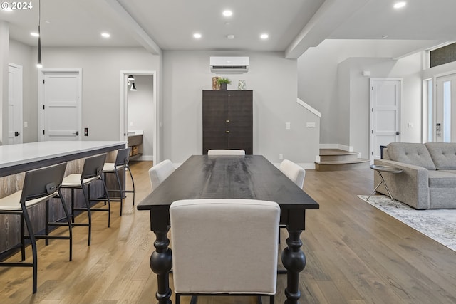 rec room featuring beamed ceiling, light wood-style flooring, and recessed lighting