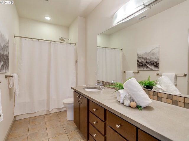 full bathroom featuring toilet, shower / bath combination with curtain, tile patterned floors, and vanity