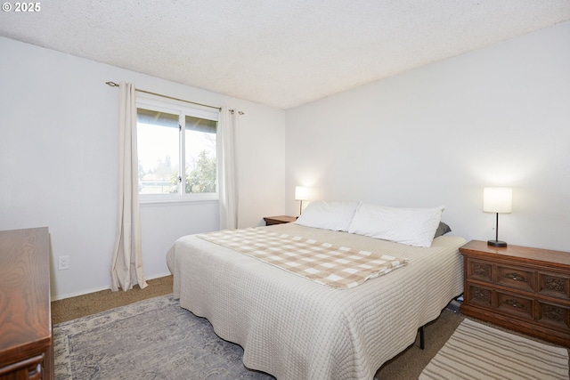 bedroom with carpet flooring and a textured ceiling