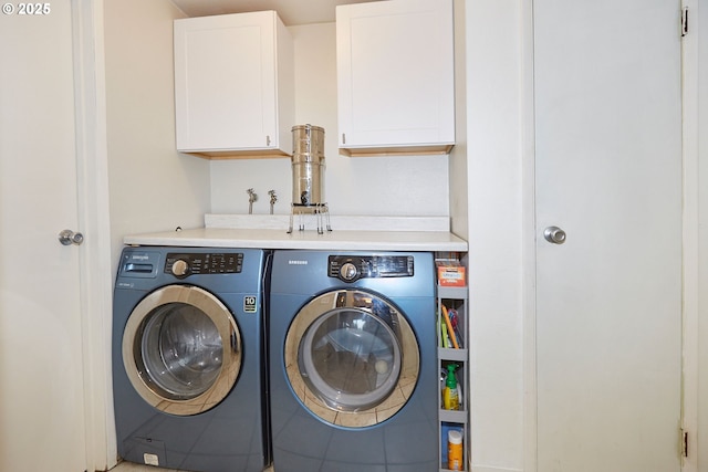 laundry room with cabinet space and washer and dryer