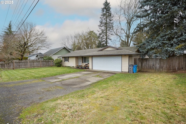 ranch-style home featuring a front yard, an attached garage, fence, and driveway