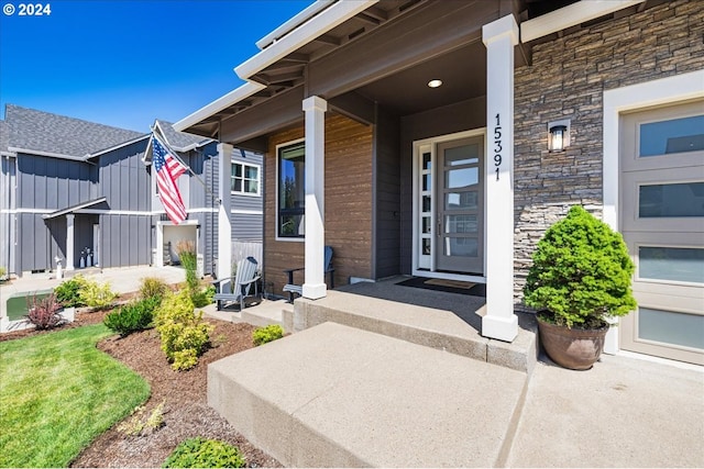 view of exterior entry featuring a porch