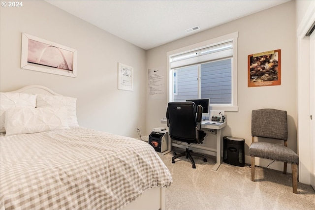 bedroom featuring light carpet