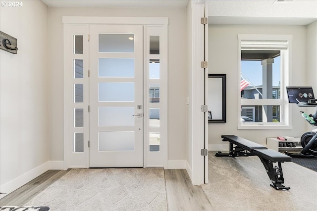 foyer with light wood-type flooring