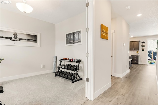 corridor featuring light hardwood / wood-style flooring