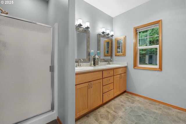 bathroom with vanity and an enclosed shower