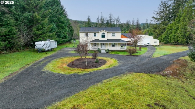 view of front of house with a front lawn and a porch