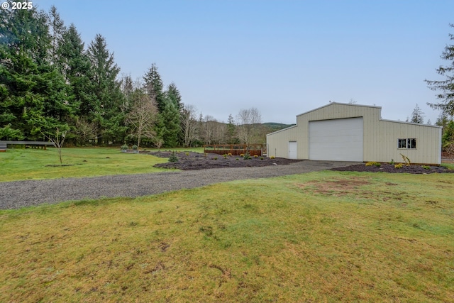 view of yard with an outbuilding and a garage